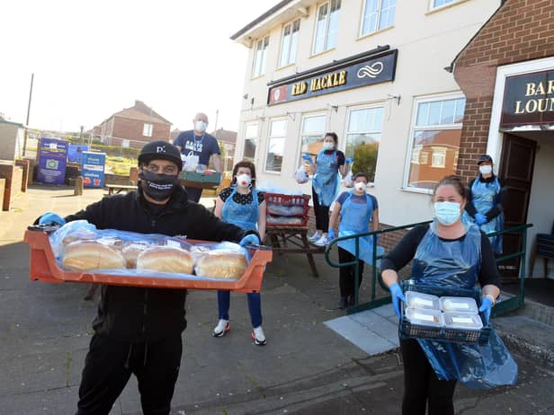 Nico Ali and Joanne Crosby make up food hampers for vulnerable residents at the Red Hackle in Jarrow.