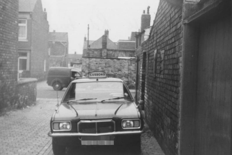 An Elwick Road back street showing a Cussons taxi.  Lansdowne Road can be seen in the background. Photo: Hartlepool Museum Service.