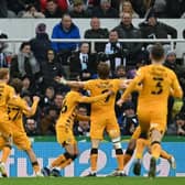 Cambridge United's English striker Joe Ironside (C) celebrates with teammates after scoring the opening goal of the English FA Cup third round football match between Newcastle United and Cambridge United at St James' Park in Newcastle-upon-Tyne, north east England on January 8, 2022.  (Photo by PAUL ELLIS/AFP via Getty Images)