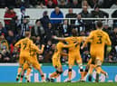 Cambridge United's English striker Joe Ironside (C) celebrates with teammates after scoring the opening goal of the English FA Cup third round football match between Newcastle United and Cambridge United at St James' Park in Newcastle-upon-Tyne, north east England on January 8, 2022.  (Photo by PAUL ELLIS/AFP via Getty Images)