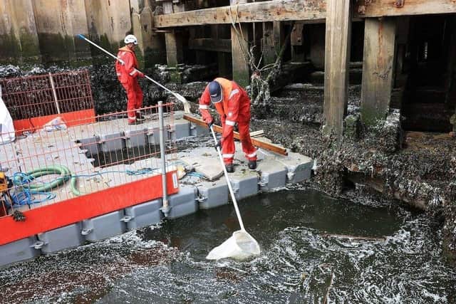Port of Tyne workers clearing nurdles from the River Tyne.