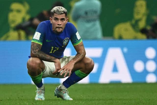 Brazil's midfielder #17 Bruno Guimaraes reacts to their defeat on the pitch after during the Qatar 2022 World Cup Group G football match between Cameroon and Brazil at the Lusail Stadium in Lusail, north of Doha on December 2, 2022. (Photo by Jewel SAMAD / AFP) (Photo by JEWEL SAMAD/AFP via Getty Images)