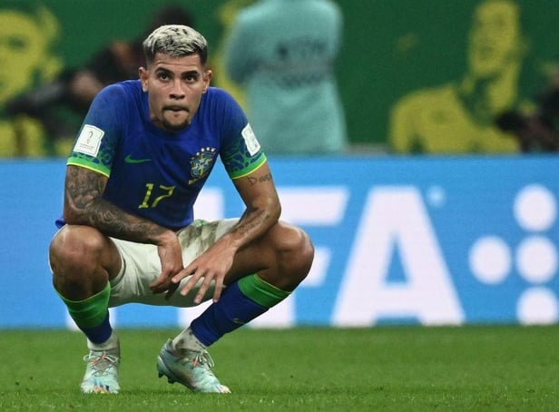 Brazil's midfielder #17 Bruno Guimaraes reacts to their defeat on the pitch after during the Qatar 2022 World Cup Group G football match between Cameroon and Brazil at the Lusail Stadium in Lusail, north of Doha on December 2, 2022. (Photo by Jewel SAMAD / AFP) (Photo by JEWEL SAMAD/AFP via Getty Images)