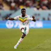 Idrissa Gana Gueye of Senegal crosses the ball during the FIFA World Cup Qatar 2022 Group A match between Ecuador and Senegal at Khalifa International Stadium on November 29, 2022 in Doha, Qatar. (Photo by Elsa/Getty Images)