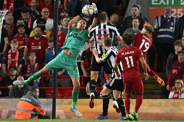 Newcastle United's English goalkeeper Nick Pope catches the ball during the English Premier League football match between Liverpool and Newcastle United at Anfield in Liverpool, north west England on August 31, 2022.  (Photo by PAUL ELLIS/AFP via Getty Images)