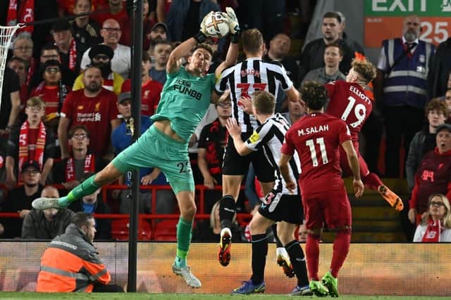 Newcastle United's English goalkeeper Nick Pope catches the ball during the English Premier League football match between Liverpool and Newcastle United at Anfield in Liverpool, north west England on August 31, 2022. (Photo by PAUL ELLIS/AFP via Getty Images)