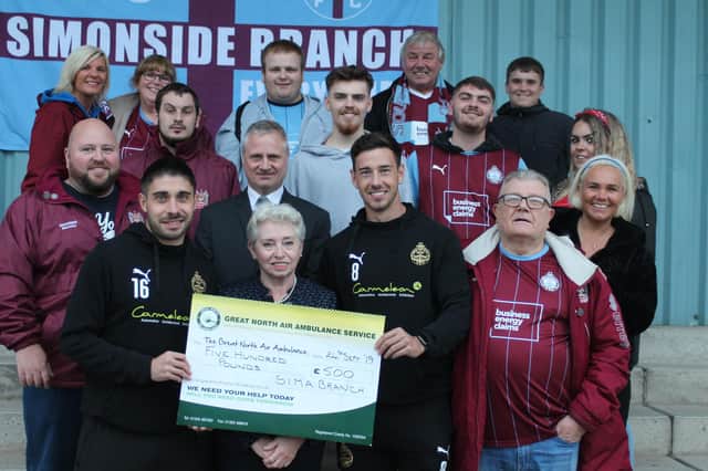 Generous fundraisers pictured with cheque