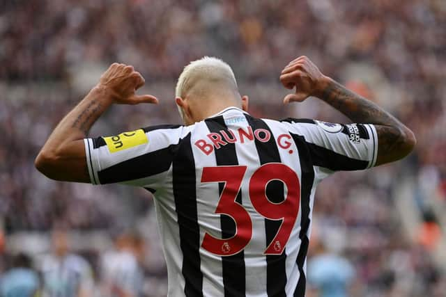 Bruno Guimaraes celebrates after scoring Newcastle United's third goal.