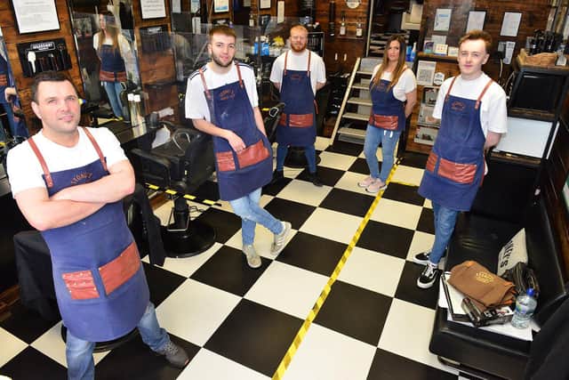 From left to right, Andrew Appleton, Liam Grant, Scott Drew, Lesley-Anne Round and Ryan Bartlett are ready to reopen at Stoney's Barber Shop.