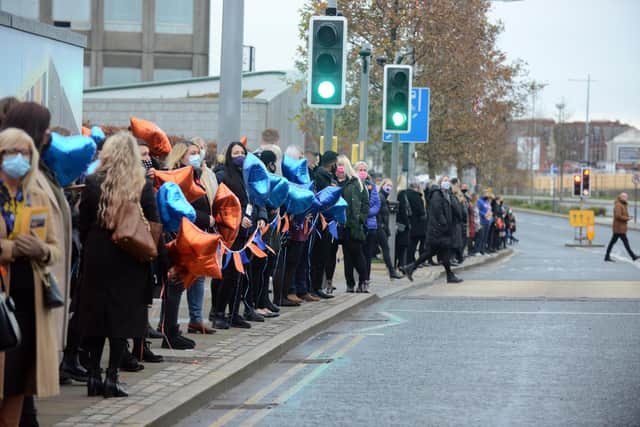 Hays Travel staff gather for the procession of John Hays funeral.