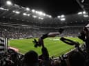 Newcastle United fans wave their scarves before the second leg of the club's Carabao Cup semi-final against Southampton.