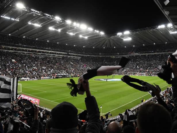 Newcastle United fans wave their scarves before the second leg of the club's Carabao Cup semi-final against Southampton.