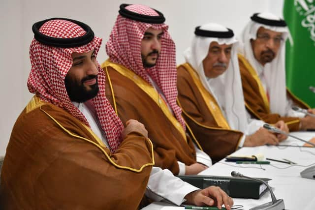 Saudi Arabia's Crown Prince Mohammed bin Salman (L) attends a meeting with Russia's President Vladimir Putin on the sidelines of the G20 Summit in Osaka on June 29, 2019. (Photo by Yuri KADOBNOV / POOL / AFP)        (Photo credit should read YURI KADOBNOV/AFP via Getty Images)