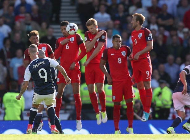 Scotland's Leigh Griffiths scores a free kick during their last game against England; a 2-2 draw at Hampden Park in 2017. PA image.