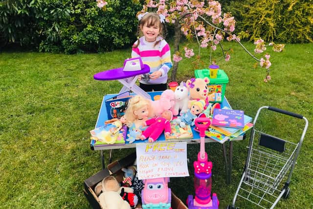 Roll up! Roll up! Mia-Angelito Wheatman has been giving away her toys and books to keep other children happy during lockdown.