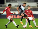 Manchester United's English striker Marcus Rashford (L) and Manchester United's English defender Luke Shaw (R) close in on Newcastle United's Brazilian striker Joelinton during the English Premier League football match between Newcastle United and Manchester United at St James' Park in Newcastle-upon-Tyne, north east England on October 17, 2020.