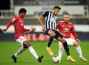 Manchester United's English striker Marcus Rashford (L) and Manchester United's English defender Luke Shaw (R) close in on Newcastle United's Brazilian striker Joelinton during the English Premier League football match between Newcastle United and Manchester United at St James' Park in Newcastle-upon-Tyne, north east England on October 17, 2020.