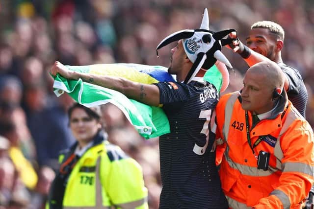 Bruno Guimaraes of Newcastle United celebrates after scoring their side's third goal during the Premier League match between Norwich City and Newcastle United at Carrow Road on April 23, 2022 in Norwich, England. (Photo by Marc Atkins/Getty Images)