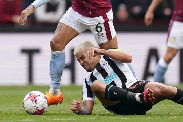 Newcastle United's Bruno Guimaraes challenges for the ball at Villa Park.