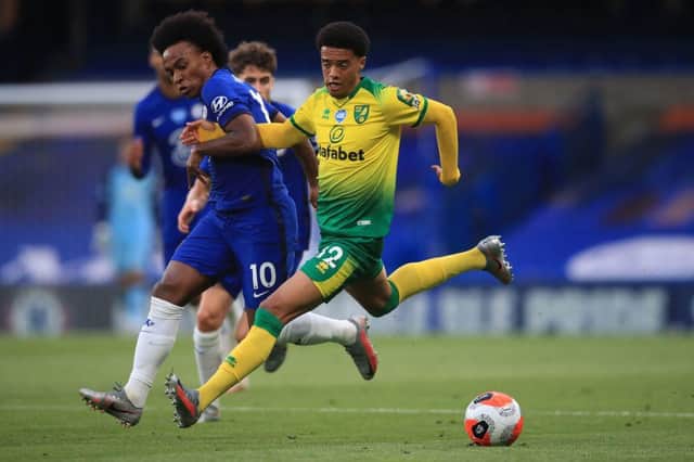 Chelsea's English midfielder Willian (L) vies with Norwich City's English-born Northern Irish defender Jamal Lewis during the English Premier League football match between Chelsea and Norwich City at Stamford Bridge in London on July 14, 2020.