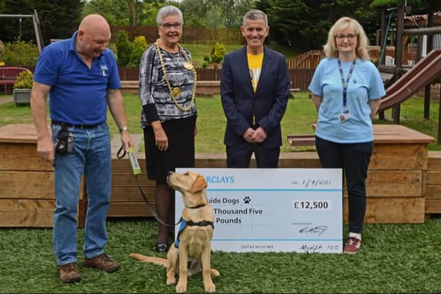 Carl Mowatt presenting his cheque to the Newcastle Guide Dog Mobility Unit with guide dog Andy and the Mayor of South Tyneside Pat Hey. Photos from Kelly Russell
