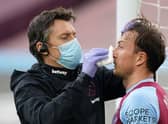 Mark Noble receives treatment during the Premier League football match between West Ham United and Leicester City at The London Stadium.