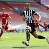 Callum Wilson of Newcastle United looks to control the ball during the Premier League match between Liverpool and Newcastle United at Anfield on April 24, 2021 in Liverpool, England.