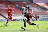 Callum Wilson of Newcastle United looks to control the ball during the Premier League match between Liverpool and Newcastle United at Anfield on April 24, 2021 in Liverpool, England.
