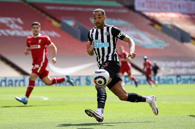 Callum Wilson of Newcastle United looks to control the ball during the Premier League match between Liverpool and Newcastle United at Anfield on April 24, 2021 in Liverpool, England.