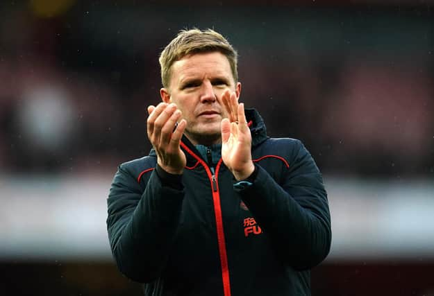 Eddie Howe applauds Newcastle United's fans at the Emirates Stadium.