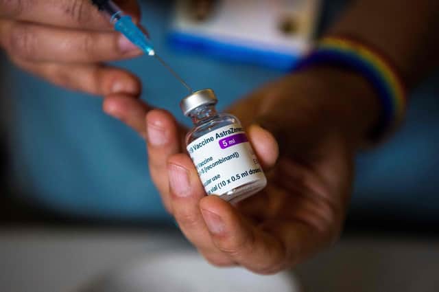 A health worker prepares a vaccine (Photo by Kirsty O'Connor / POOL / AFP) (Photo by KIRSTY O'CONNOR/POOL/AFP via Getty Images)