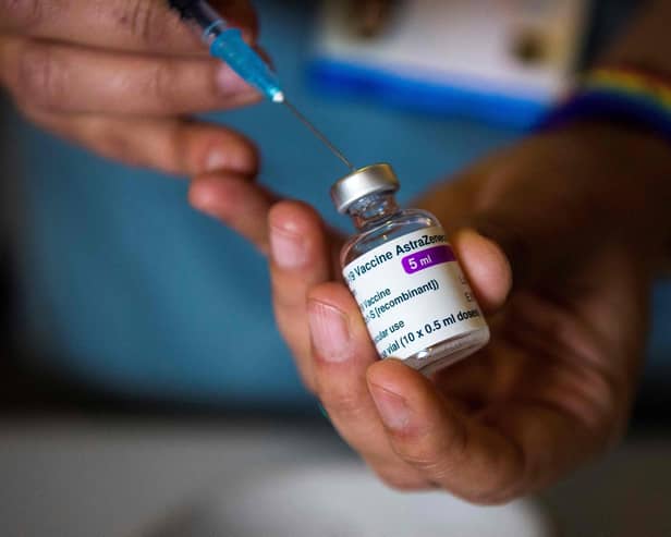 A health worker prepares a vaccine (Photo by Kirsty O'Connor / POOL / AFP) (Photo by KIRSTY O'CONNOR/POOL/AFP via Getty Images)