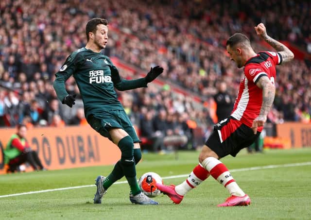 SOUTHAMPTON, ENGLAND - MARCH 07: Javier Manquillo of Newcastle United is tackled by Danny Ings of Southampton during the Premier League match between Southampton FC and Newcastle United at St Mary's Stadium on March 07, 2020 in Southampton, United Kingdom. (Photo by Jordan Mansfield/Getty Images)