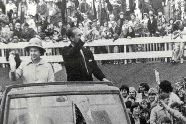 Mea Deen, right, running to catch up with the Royal car - and his brother Fazel chasing behind him. Photo: Freddie Mudditt (Fietscher Fotos)