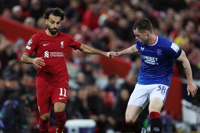 Rangers defender Leon King alongside Liverpool's Mo Salah during their Champions League group stage clash (Photo by Clive Brunskill/Getty Images)