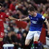 Rangers defender Leon King alongside Liverpool's Mo Salah during their Champions League group stage clash (Photo by Clive Brunskill/Getty Images)