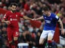 Rangers defender Leon King alongside Liverpool's Mo Salah during their Champions League group stage clash (Photo by Clive Brunskill/Getty Images)