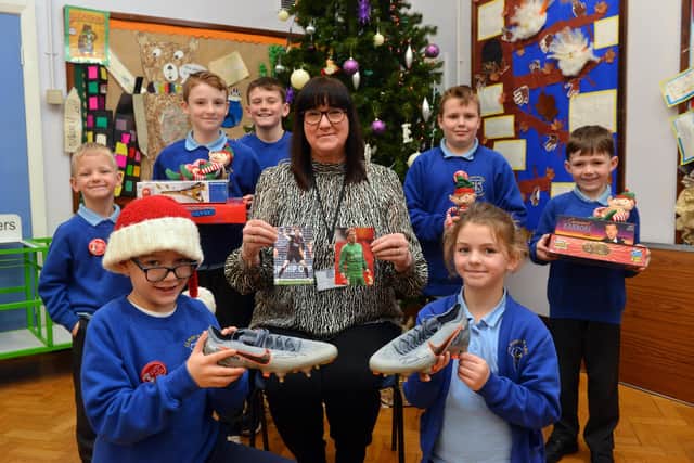 SS Peter and Paul Catholic Primary School headteacher Maria Butt is to raffle Jordan Pickford's boots as part of the Christmas appeal. 