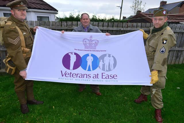 Army veteran Trevor Gray (left) in the uniform of the Durham Light Infantry 1914-1918 along with fellow army veteran Kevin Merritt (right) in USA Airborne uniform from 1942-1945 who are walking from Seaham to South Shields to raise funds for Veterans at Ease, with back up from Mike Gray (centre) former Royal Signals Regiment. Picture by FRANK REID