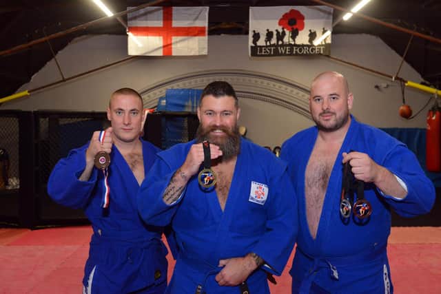 Sunderland Red Star Sambo Wrestling Club win GB competition. From left Brent Mitchell-Wright, owner and coach Barry Gibson and Mark Stuck.