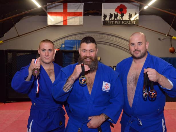 Sunderland Red Star Sambo Wrestling Club win GB competition. From left Brent Mitchell-Wright, owner and coach Barry Gibson and Mark Stuck.
