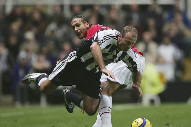 Newcastle United legend Alan Shearer playing against Manchester United's Rio Ferdinand in 2004. (Photo by Alex Livesey/Getty Images)