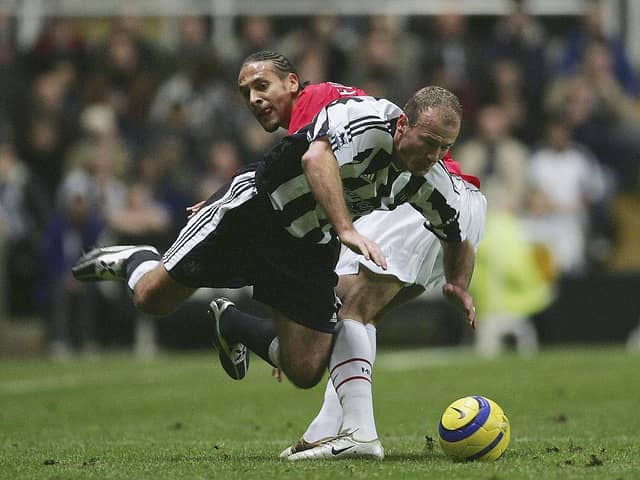 Newcastle United legend Alan Shearer playing against Manchester United's Rio Ferdinand in 2004. (Photo by Alex Livesey/Getty Images)