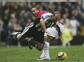 Newcastle United legend Alan Shearer playing against Manchester United's Rio Ferdinand in 2004. (Photo by Alex Livesey/Getty Images)