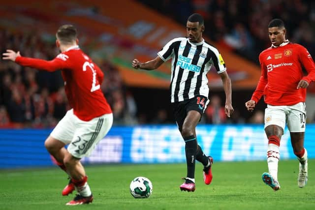 Alexander Isak of Newcastle United runs with the ball whilst under pressure from Marcus Rashford of Manchester United during the Carabao Cup Final match between Manchester United and Newcastle United at Wembley Stadium on February 26, 2023 in London, England. (Photo by Eddie Keogh/Getty Images)