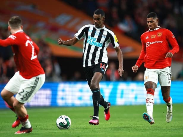Alexander Isak of Newcastle United runs with the ball whilst under pressure from Marcus Rashford of Manchester United during the Carabao Cup Final match between Manchester United and Newcastle United at Wembley Stadium on February 26, 2023 in London, England. (Photo by Eddie Keogh/Getty Images)