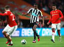 Alexander Isak of Newcastle United runs with the ball whilst under pressure from Marcus Rashford of Manchester United during the Carabao Cup Final match between Manchester United and Newcastle United at Wembley Stadium on February 26, 2023 in London, England. (Photo by Eddie Keogh/Getty Images)