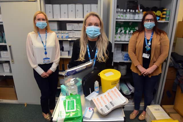 Community pharmacists Louise Lydon, centre, and Laura Rowley, left, and commissioner officer NECS Nicola Morrow, right, with the vaccination preparation kit to visit housebound patients.