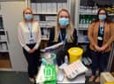 Community pharmacists Louise Lydon, centre, and Laura Rowley, left, and commissioner officer NECS Nicola Morrow, right, with the vaccination preparation kit to visit housebound patients.