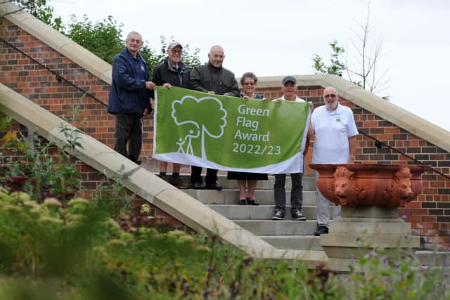 Coun Ernest Gibson and Coun Ruth Berkley join Friends of North and South Marine Parks with the parks Green Flag award.